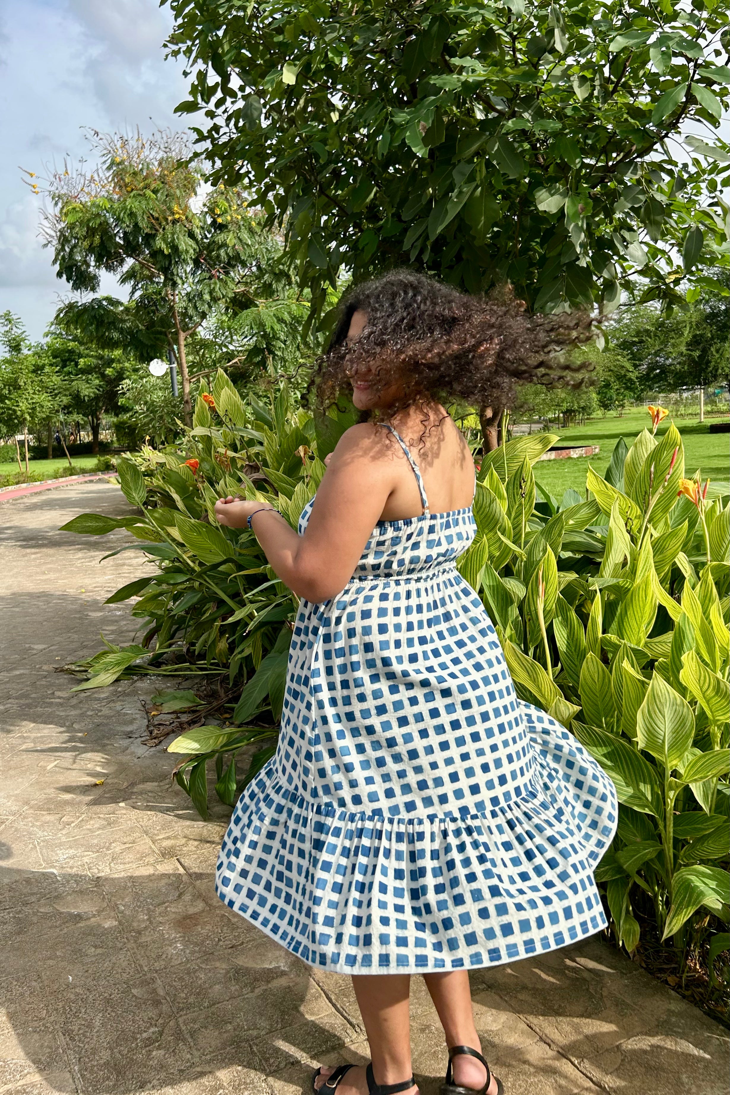 Ira checked midi dress with flared tiered hem in motion