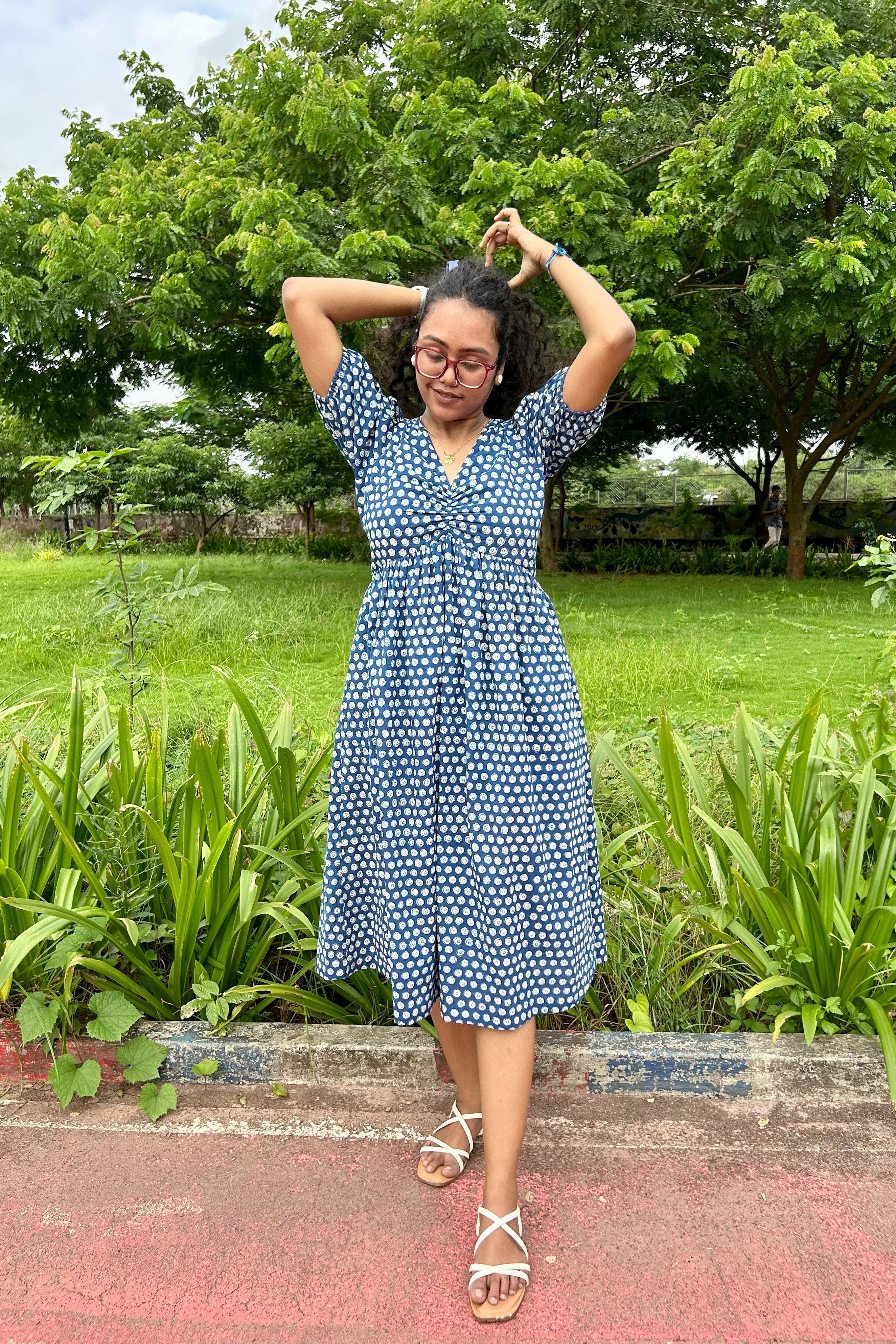 Mira indigo midi dress in motion