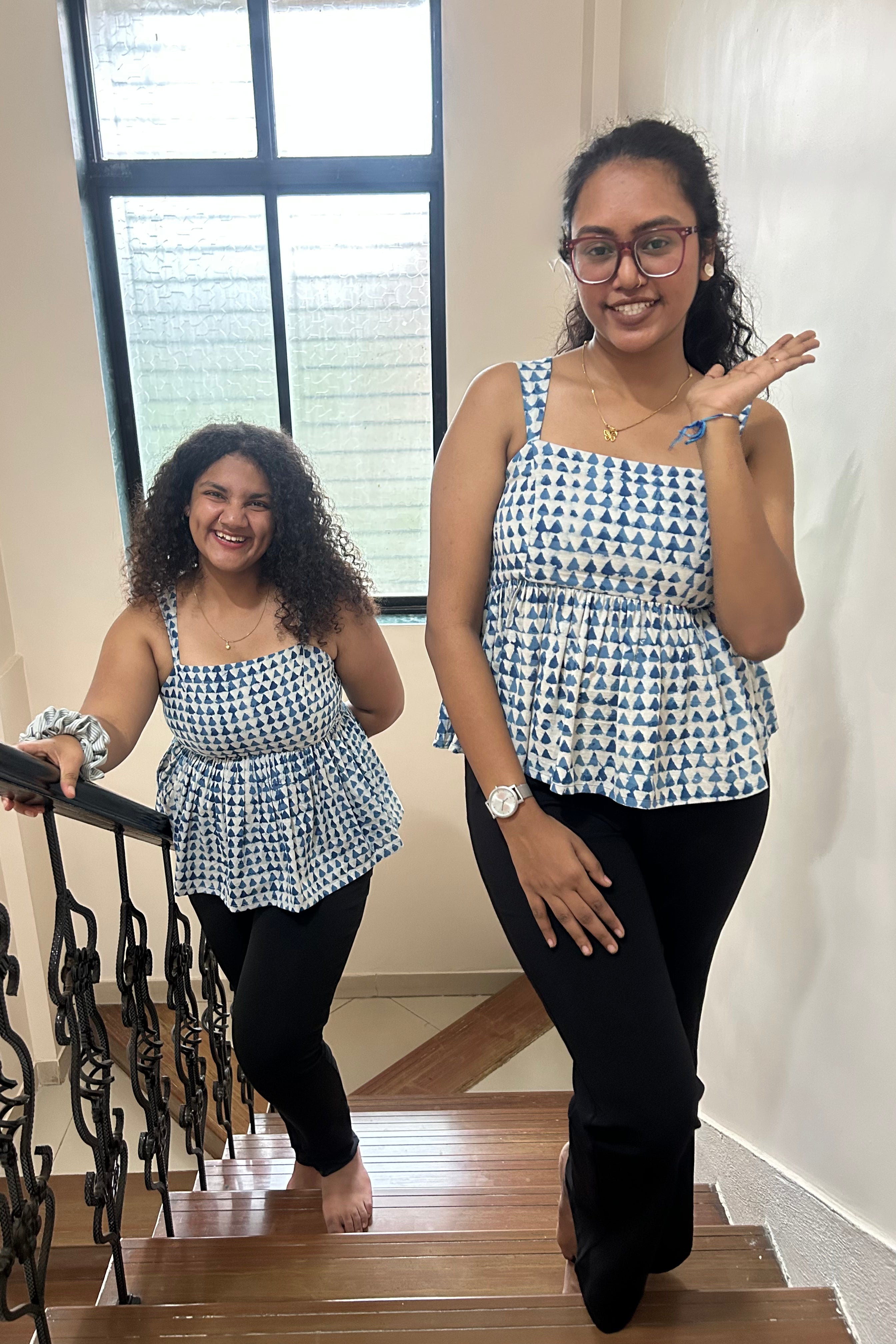 Sia peplum top shown on two models in different sizes