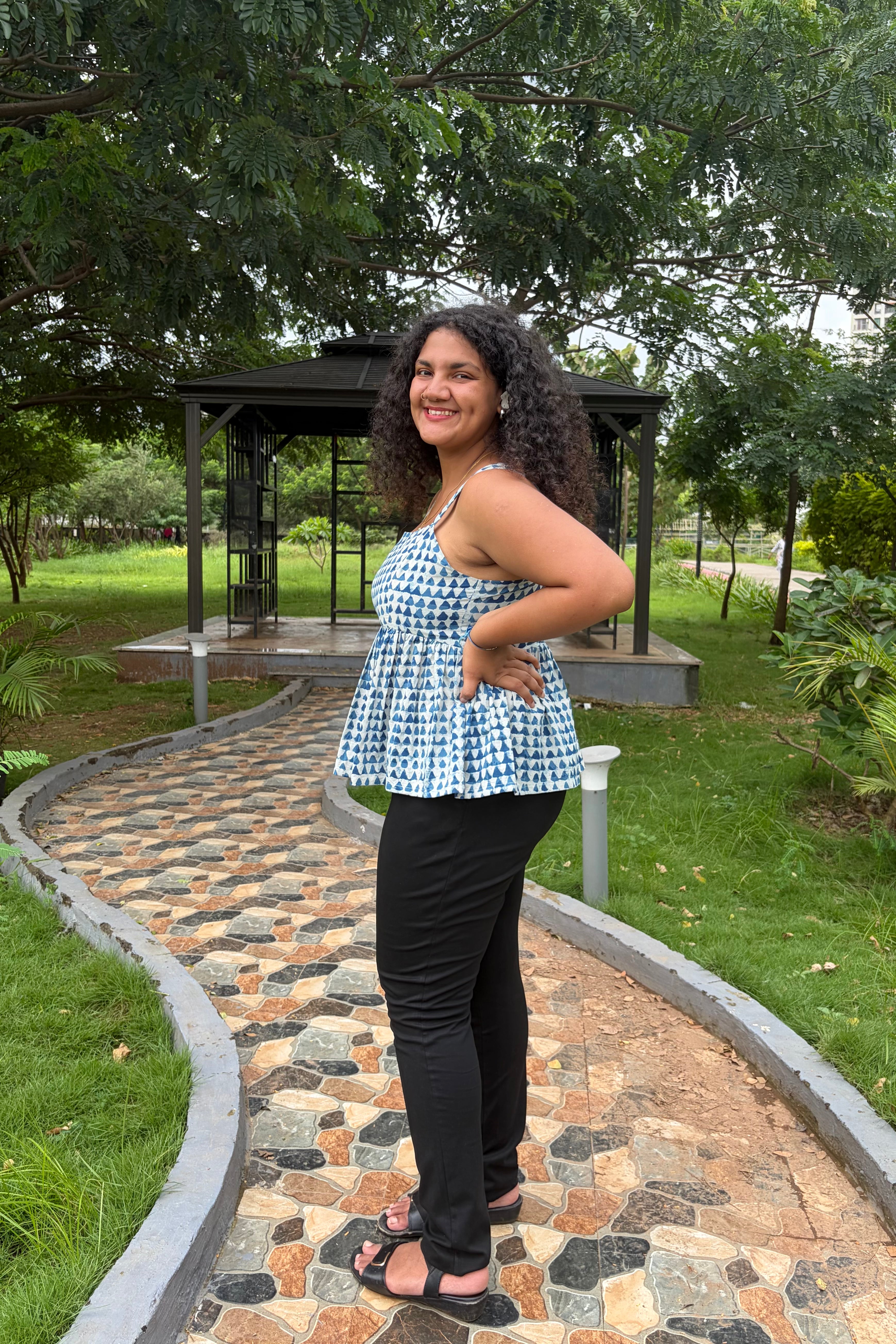Tia indigo peplum top styled with black jeans
