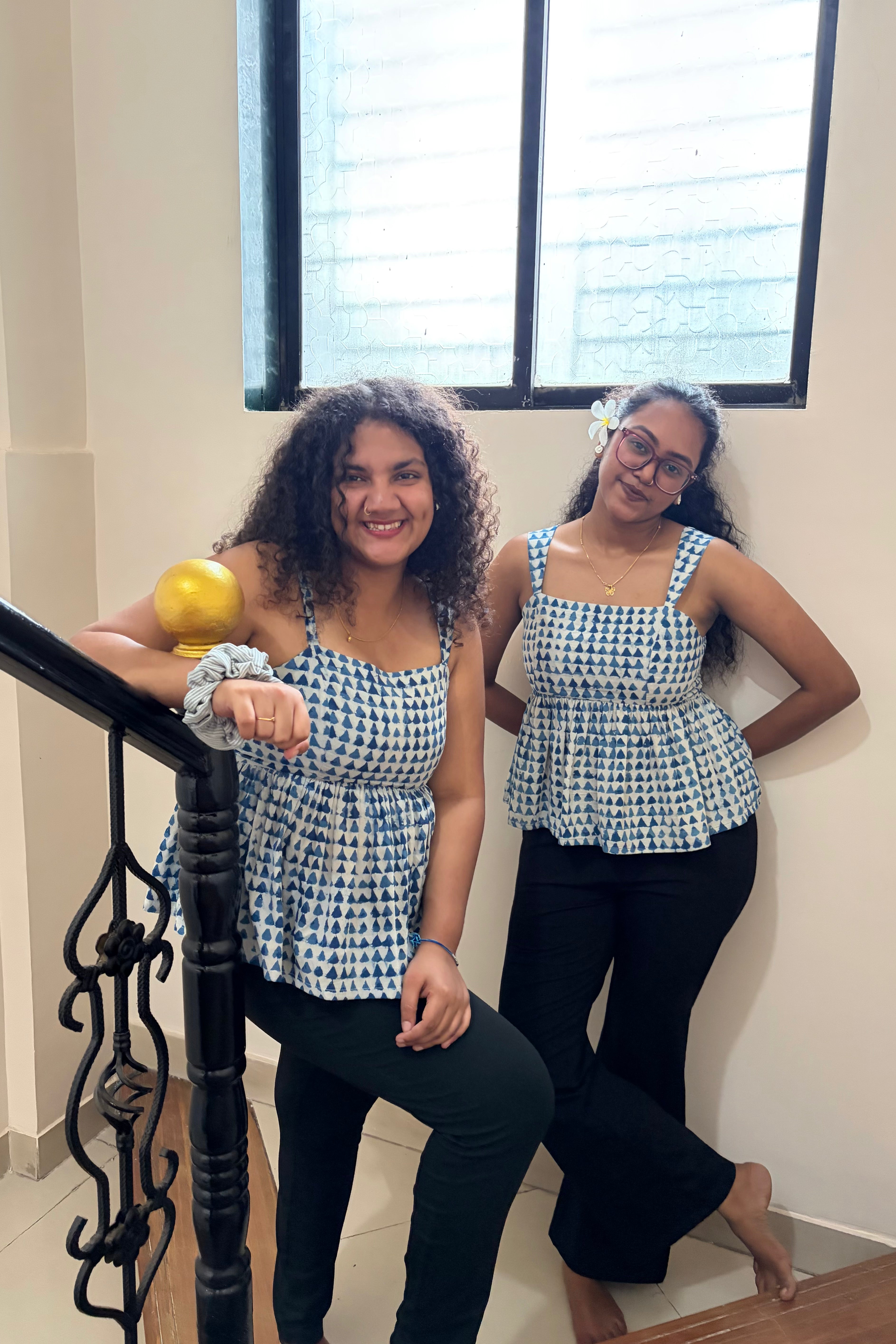 Sia peplum top shown on two models in different sizes